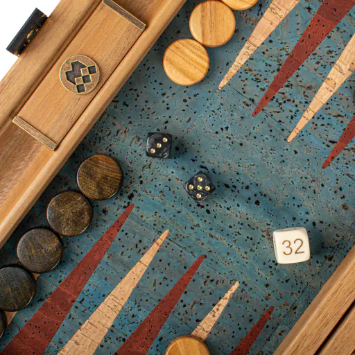 A close-up of a backgammon board and playing pieces